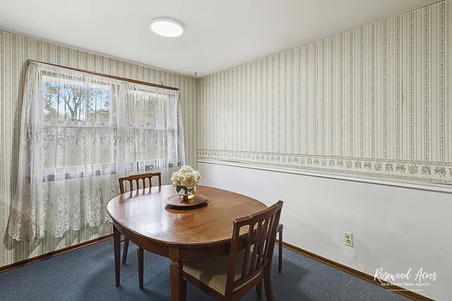 a kitchen with a appliances cabinets and wooden floor