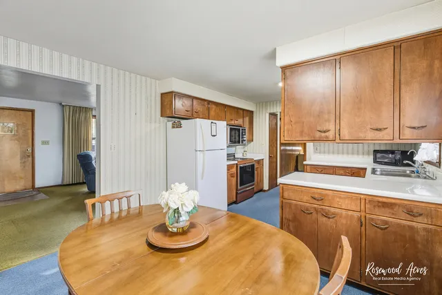a kitchen with a sink cabinets and window