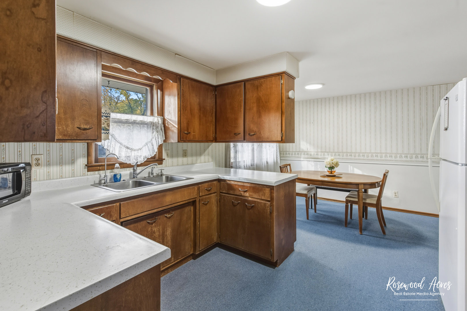 2308 1500 South Kankakee, IL 60901 - Photo 8 of 22 a kitchen with a sink cabinets and window