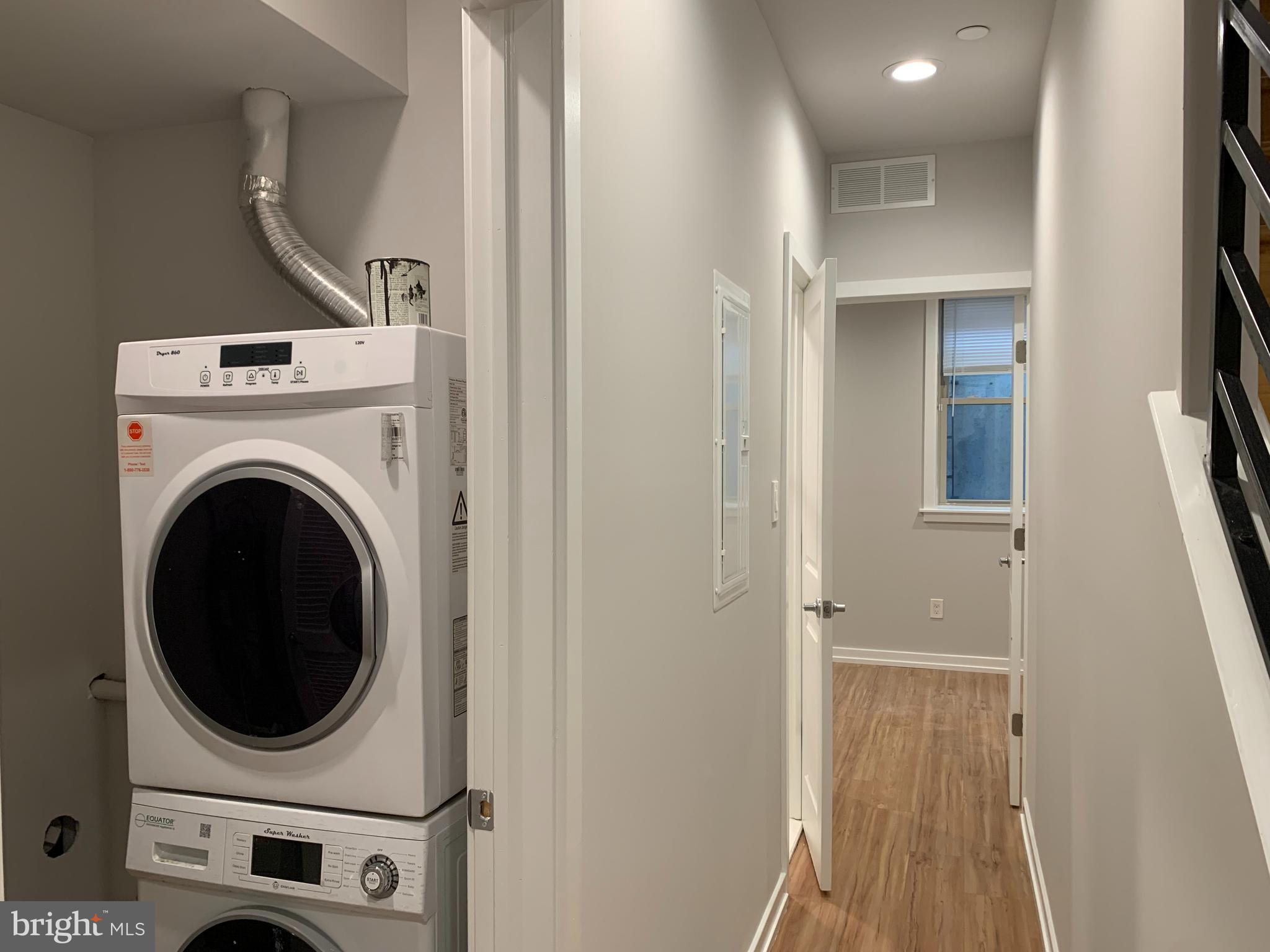 1268 South 27th Street, Unit 1 Philadelphia, PA 19146 - Photo 19 of 26 a view of a storage & utility room with dryer and washer