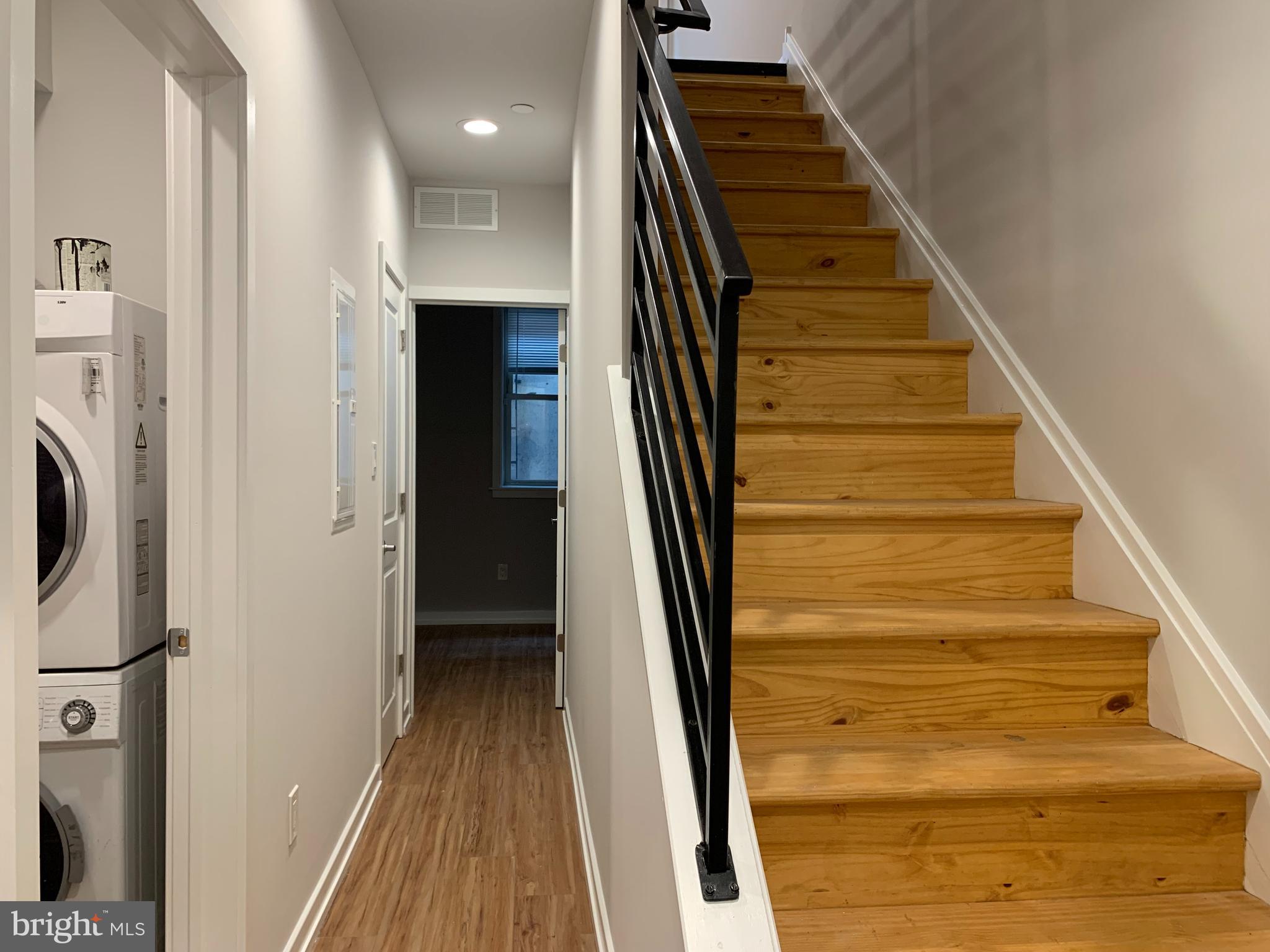 1268 South 27th Street, Unit 1 Philadelphia, PA 19146 - Photo 20 of 26 a view of stairs and wooden floor