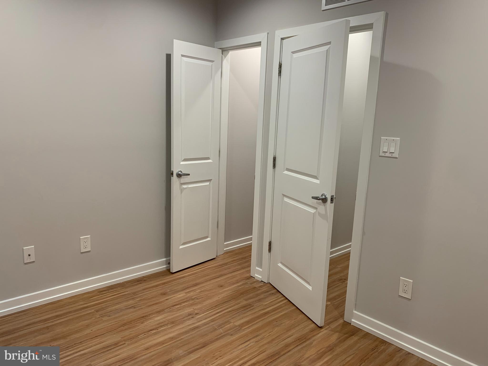 1268 South 27th Street, Unit 1 Philadelphia, PA 19146 - Photo 22 of 26 a view of a bathroom with wooden floor