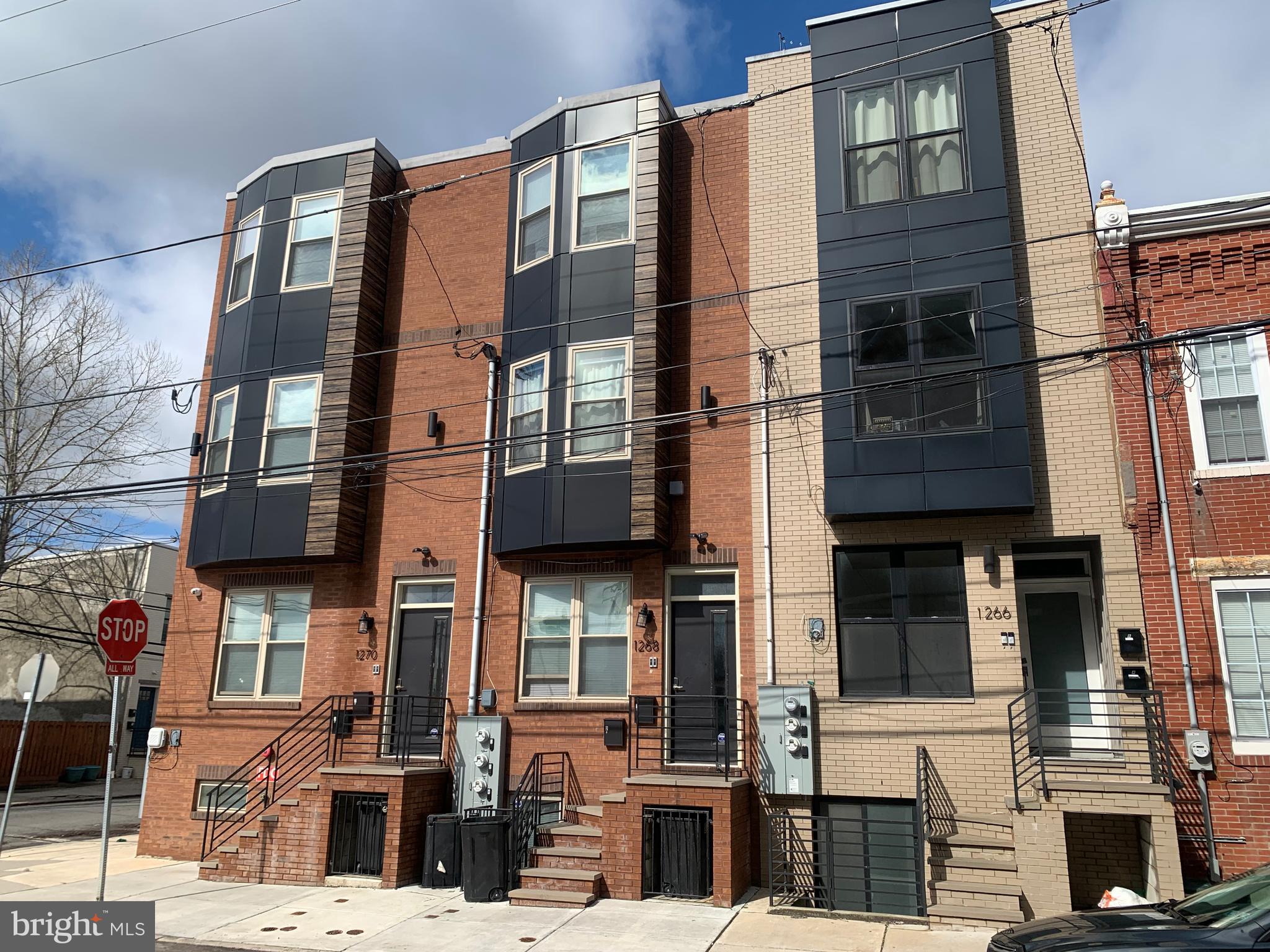 1268 South 27th Street, Unit 1 Philadelphia, PA 19146 - Photo 26 of 26 a tall building sitting on the side of a street