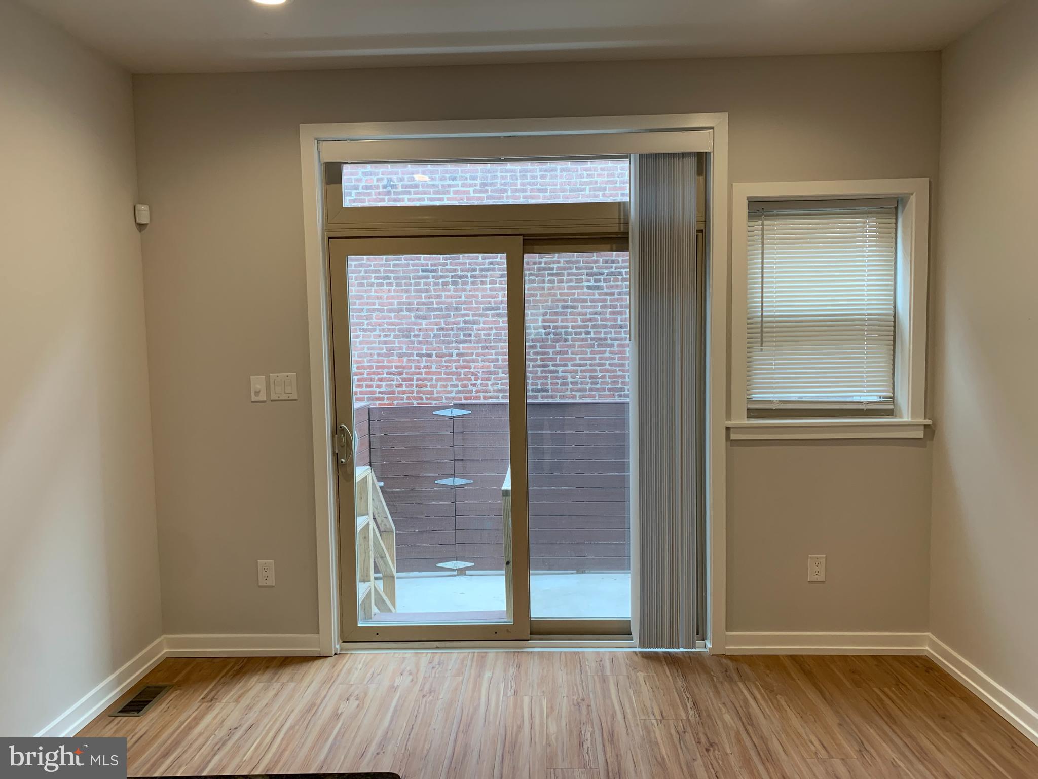 1268 South 27th Street, Unit 1 Philadelphia, PA 19146 - Photo 6 of 26 wooden floor and windows in a room