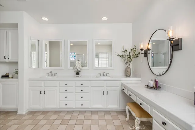 a bathroom with a sink a vanity and a mirror
