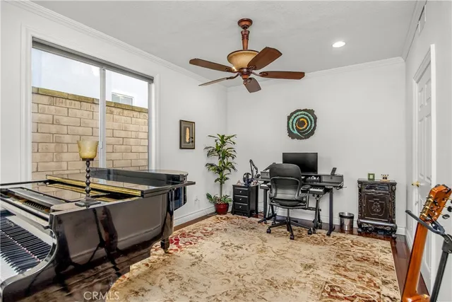 a living room with a couch a dining table and a window