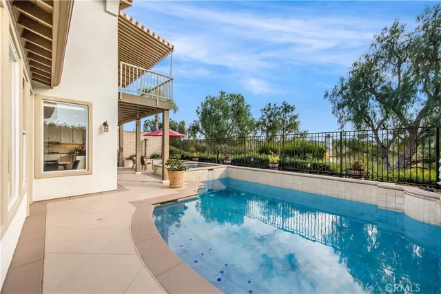 a view of a swimming pool with a patio