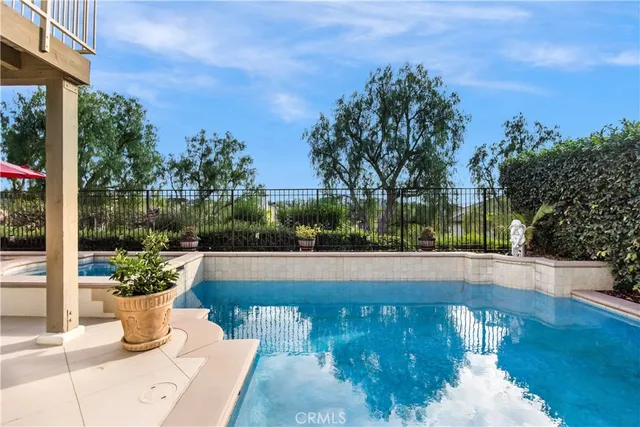a view of a fountain with flower in it