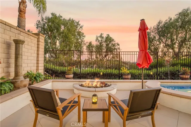 a swimming pool with outdoor seating and yard
