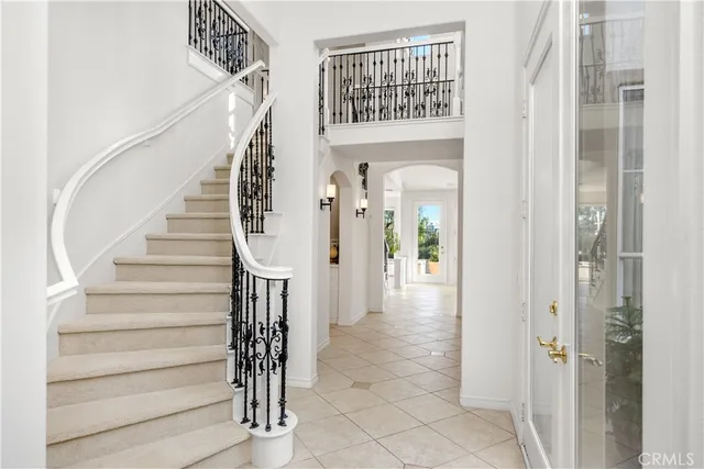a view of entryway and hall with a front door
