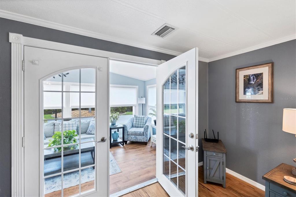 10303 Burnt Store Road, Unit 5 Punta Gorda, FL 33950 - Photo 11 of 49 a living room with furniture and a large window