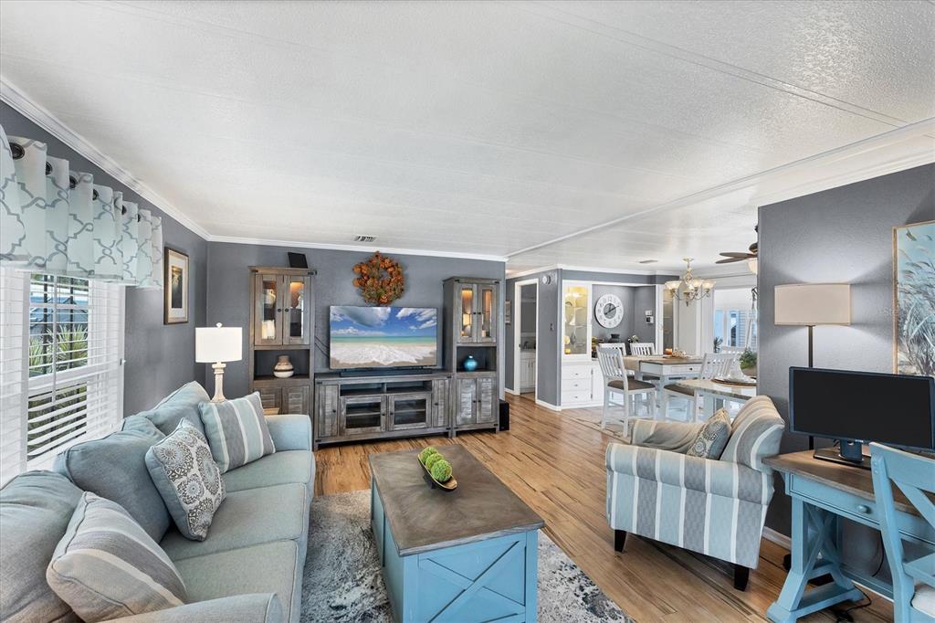 10303 Burnt Store Road, Unit 5 Punta Gorda, FL 33950 - Photo 12 of 49 a living room with furniture and a flat screen tv