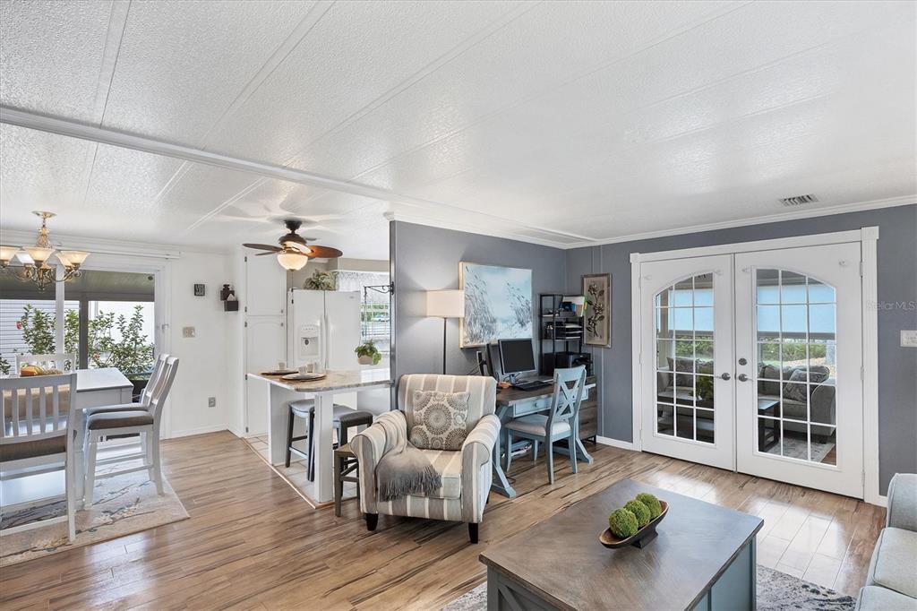 10303 Burnt Store Road, Unit 5 Punta Gorda, FL 33950 - Photo 13 of 49 a living room with furniture and wooden floor
