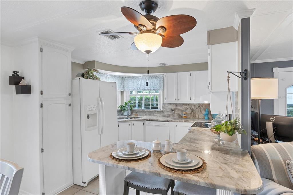 10303 Burnt Store Road, Unit 5 Punta Gorda, FL 33950 - Photo 19 of 49 a view of a dining room with furniture