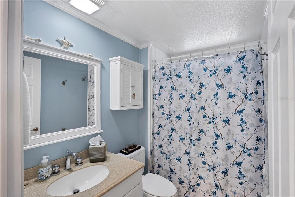 10303 Burnt Store Road, Unit 5 Punta Gorda, FL 33950 - Photo 30 of 49 a bathroom with a sink toilet and shower