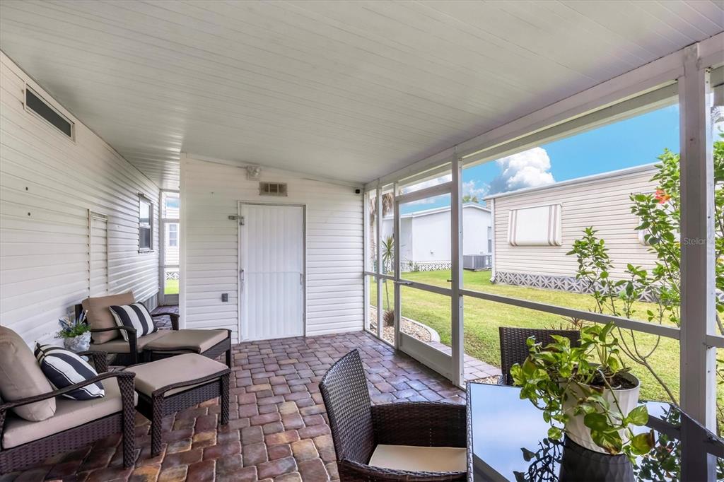 10303 Burnt Store Road, Unit 5 Punta Gorda, FL 33950 - Photo 32 of 49 a bedroom with furniture and a potted plant