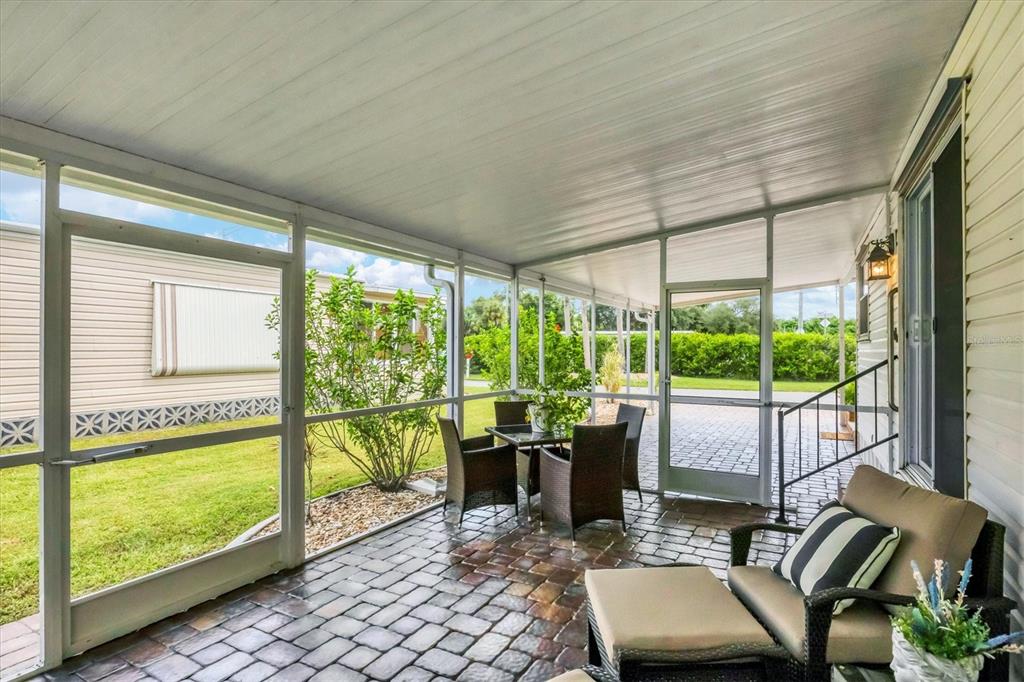 10303 Burnt Store Road, Unit 5 Punta Gorda, FL 33950 - Photo 33 of 49 a room with furniture and large windows