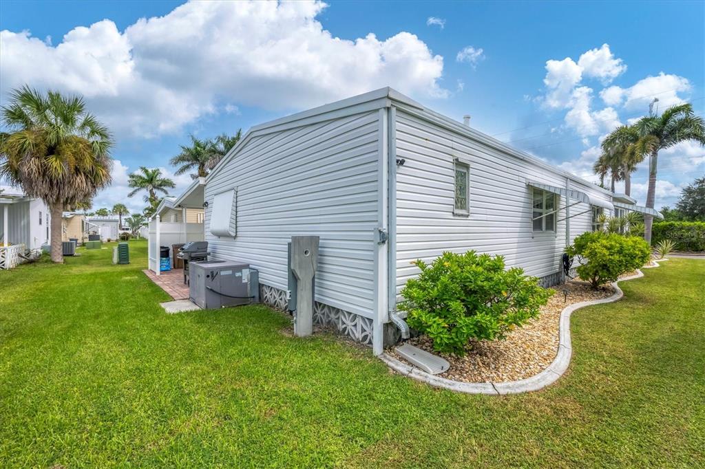 10303 Burnt Store Road, Unit 5 Punta Gorda, FL 33950 - Photo 34 of 49 a house view with a garden space