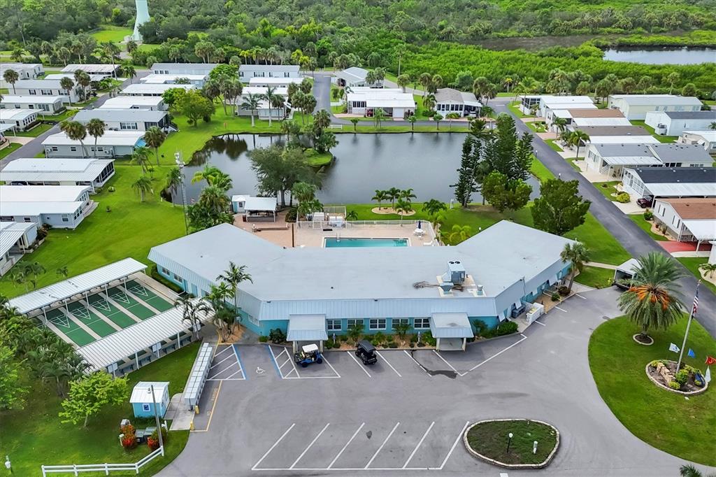 10303 Burnt Store Road, Unit 5 Punta Gorda, FL 33950 - Photo 36 of 49 an aerial view of a house with garden space and street view