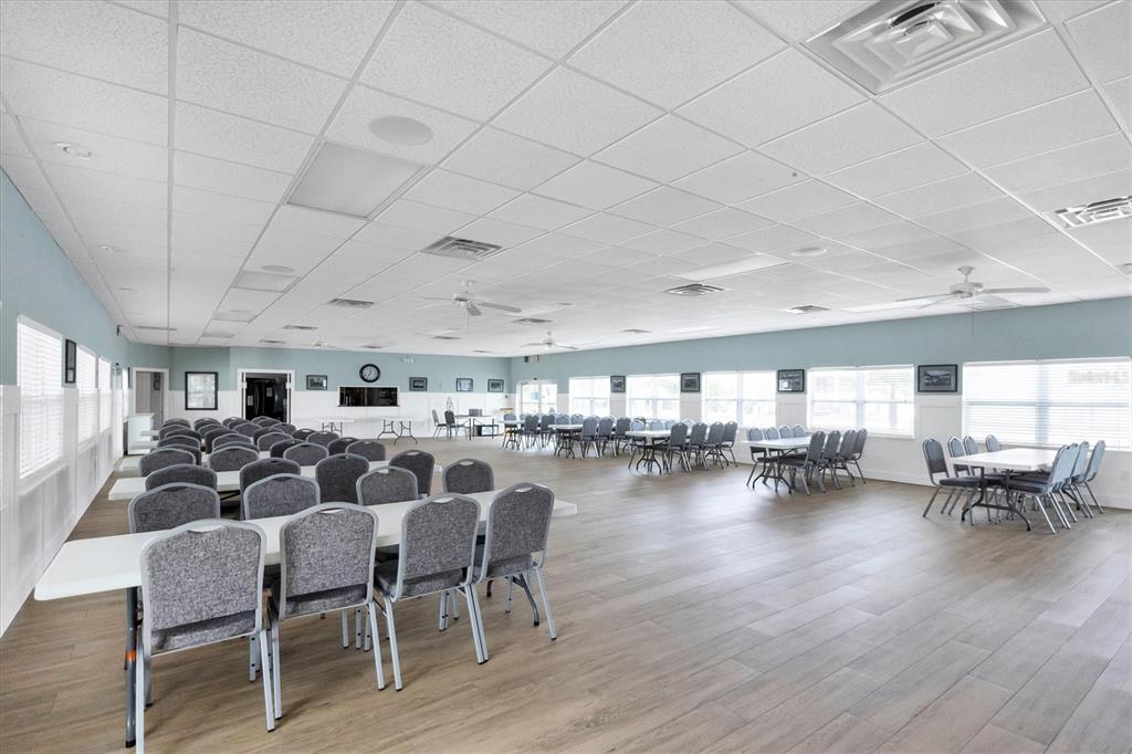 10303 Burnt Store Road, Unit 5 Punta Gorda, FL 33950 - Photo 37 of 49 a view of a dining room with furniture window and wooden floor