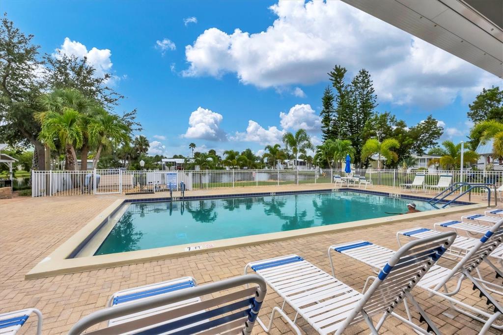 10303 Burnt Store Road, Unit 5 Punta Gorda, FL 33950 - Photo 38 of 49 a view of a swimming pool with a patio