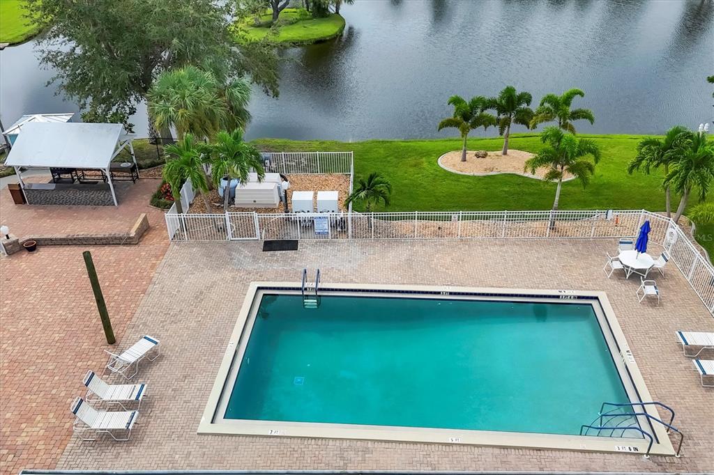 10303 Burnt Store Road, Unit 5 Punta Gorda, FL 33950 - Photo 39 of 49 a room with painting on the wall and a potted plant