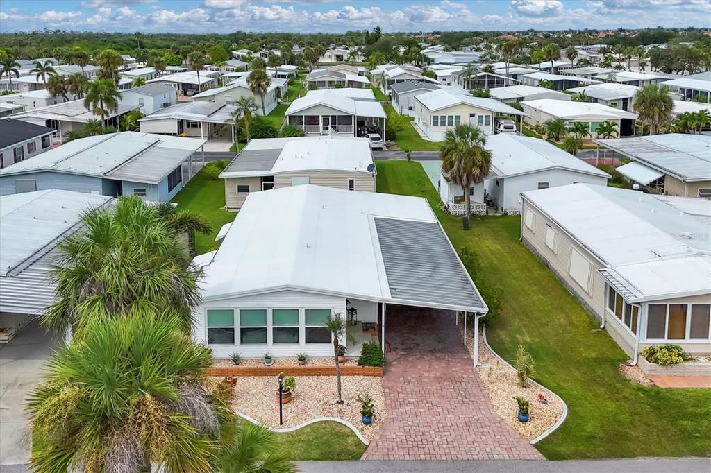 10303 Burnt Store Road, Unit 5 Punta Gorda, FL 33950 - Photo 4 of 49 an aerial view of a house with garden space and lake view
