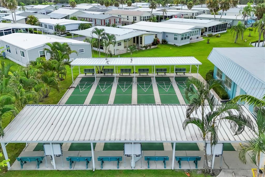 10303 Burnt Store Road, Unit 5 Punta Gorda, FL 33950 - Photo 42 of 49 a aerial view of a house with a yard table and chairs