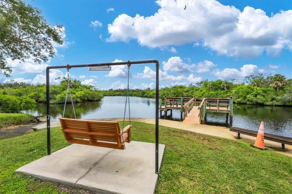 10303 Burnt Store Road, Unit 5 Punta Gorda, FL 33950 - Photo 45 of 49 a garden view with a sitting space and garden