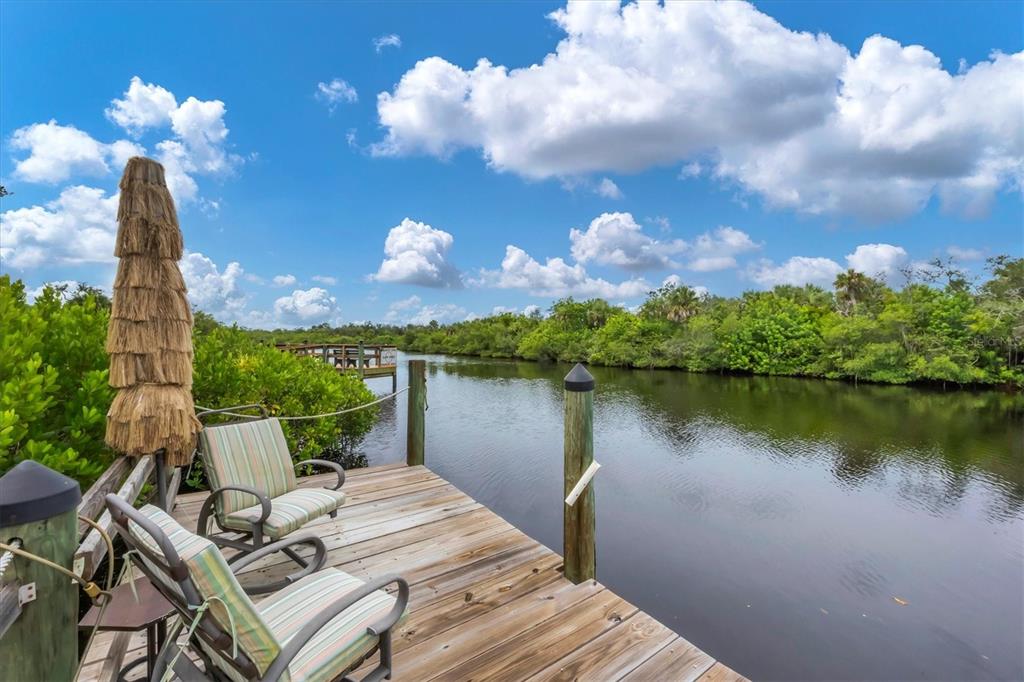 10303 Burnt Store Road, Unit 5 Punta Gorda, FL 33950 - Photo 49 of 49 a view of a house with a lake from a balcony