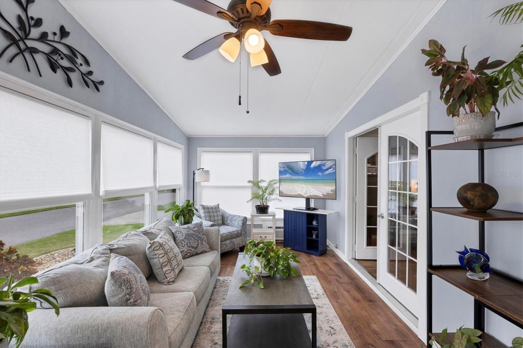 10303 Burnt Store Road, Unit 5 Punta Gorda, FL 33950 - Photo 7 of 49 a living room with furniture potted plant floor to ceiling window