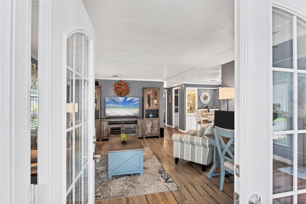 10303 Burnt Store Road, Unit 5 Punta Gorda, FL 33950 - Photo 10 of 49 a living room with furniture and a flat screen tv