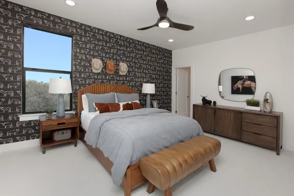 a bedroom with a bed furniture and a window