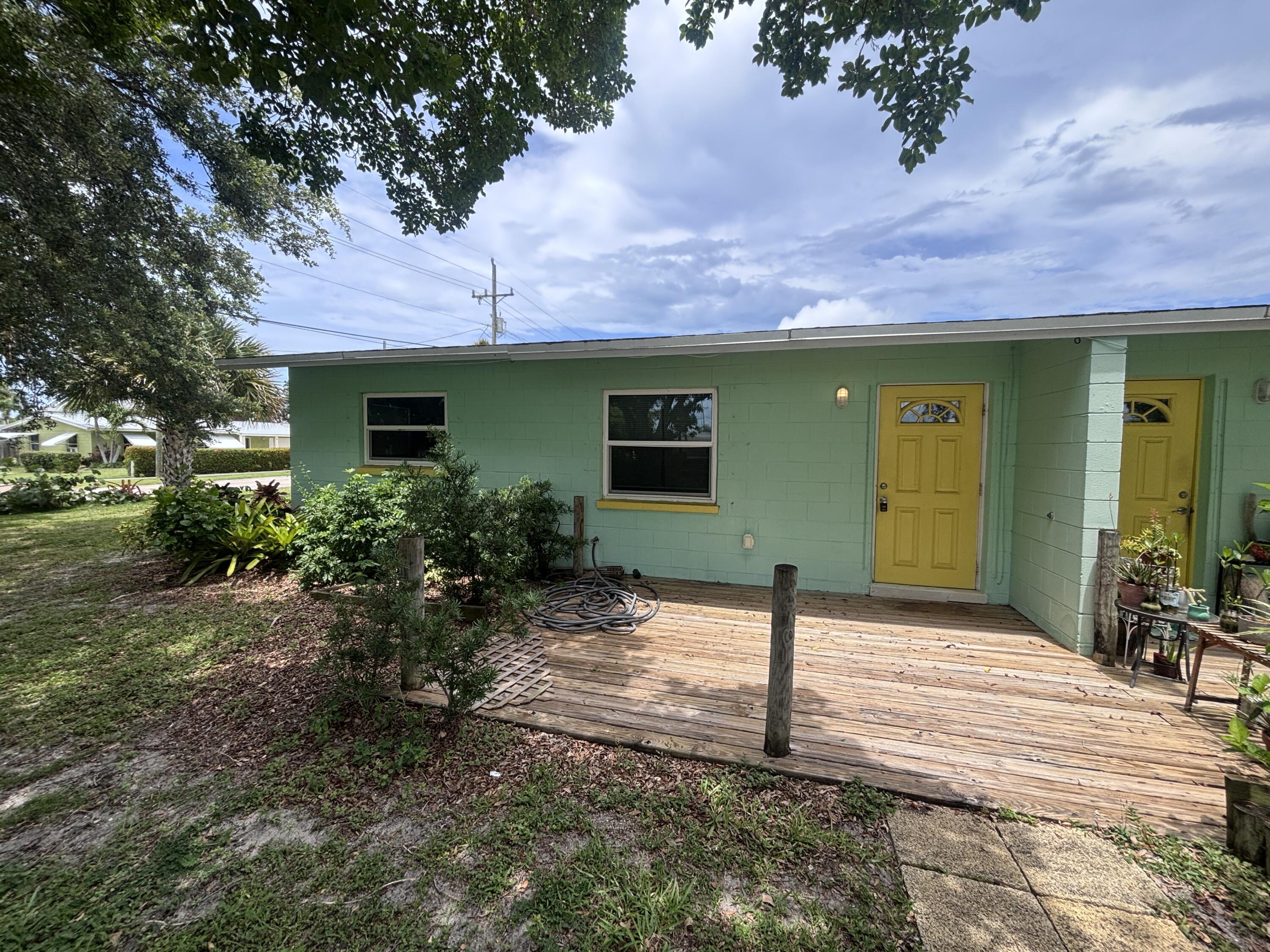 202 Balboa Street, Unit A Fort Pierce, FL 34949 - Photo 1 of 10 a front view of a house with garden