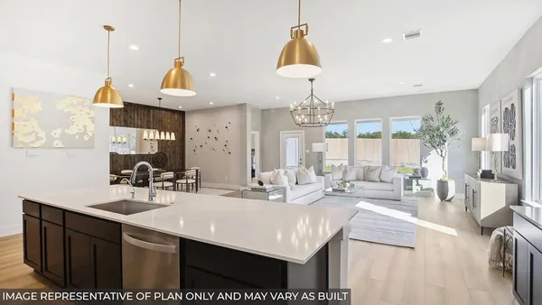 a kitchen with kitchen island granite countertop a sink a counter top space and living room view