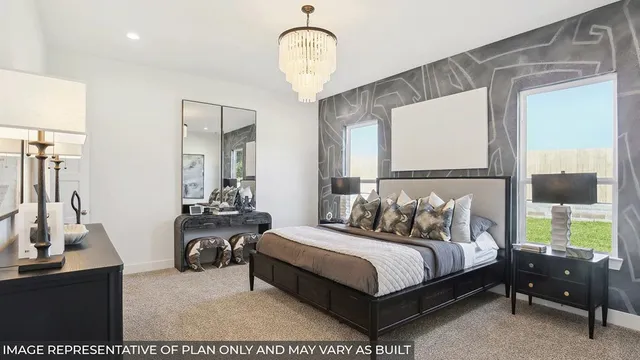 a bedroom with a bed mirror and a chandelier