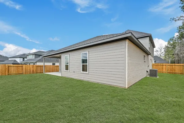 a view of a backyard of the house