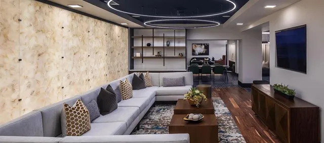 a room with furniture and chandelier