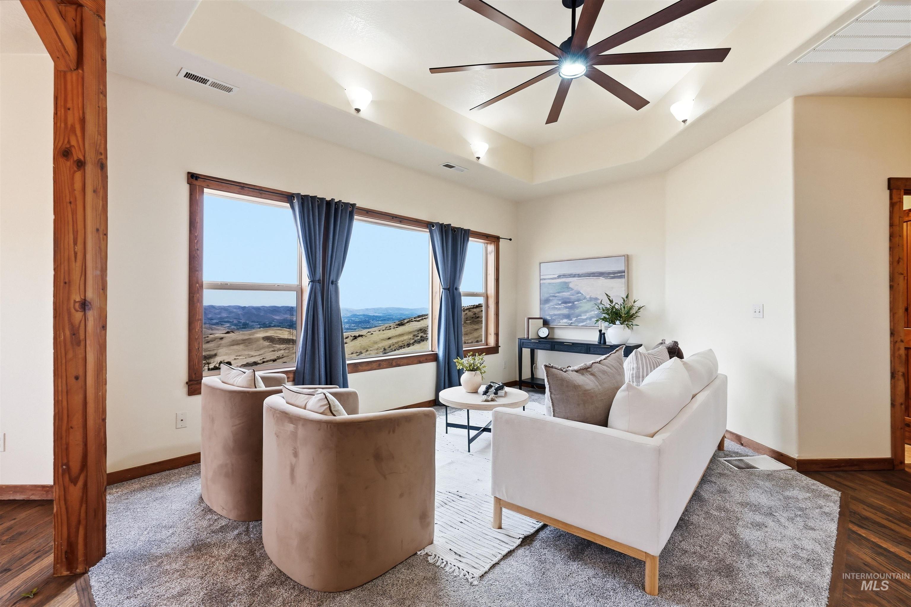 3645 Butte Road Emmett, ID 83617 - Photo 10 of 39 Tray ceiling with a contemporary ceiling fan and recessed lighting
