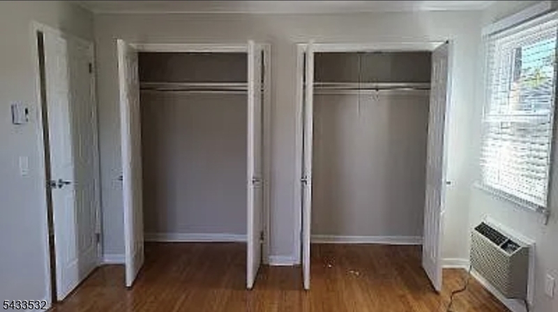 16 Ocean Street Millburn, NJ 07041 - Photo 23 of 26 a view of an empty room with wooden floor and a window