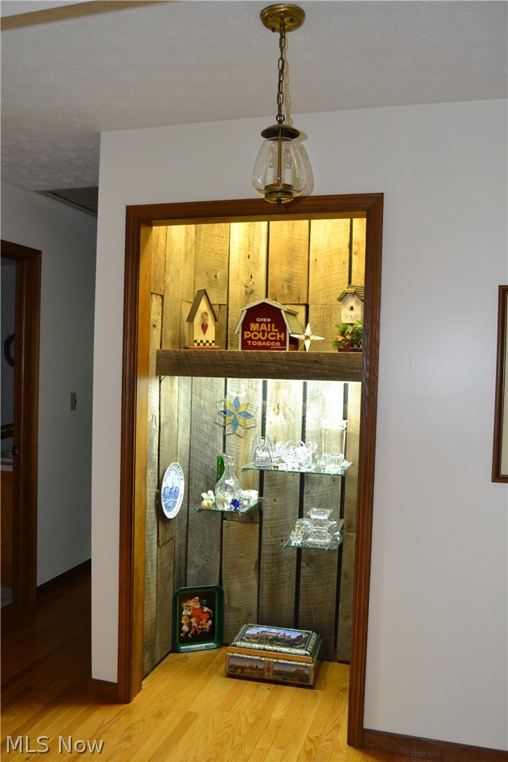 742 Highland Ridge Road Lowell, OH 45744 - Photo 30 of 31 The foyer is now a display cabinet but is easily converted back to a closet. Don't you just love the barn siding?