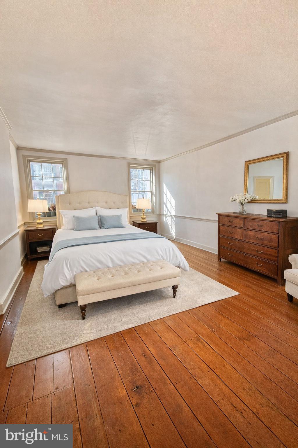 119 Prince Street, Unit 1 Alexandria, VA 22314 - Photo 2 of 29 a bedroom with a bed and a dresser