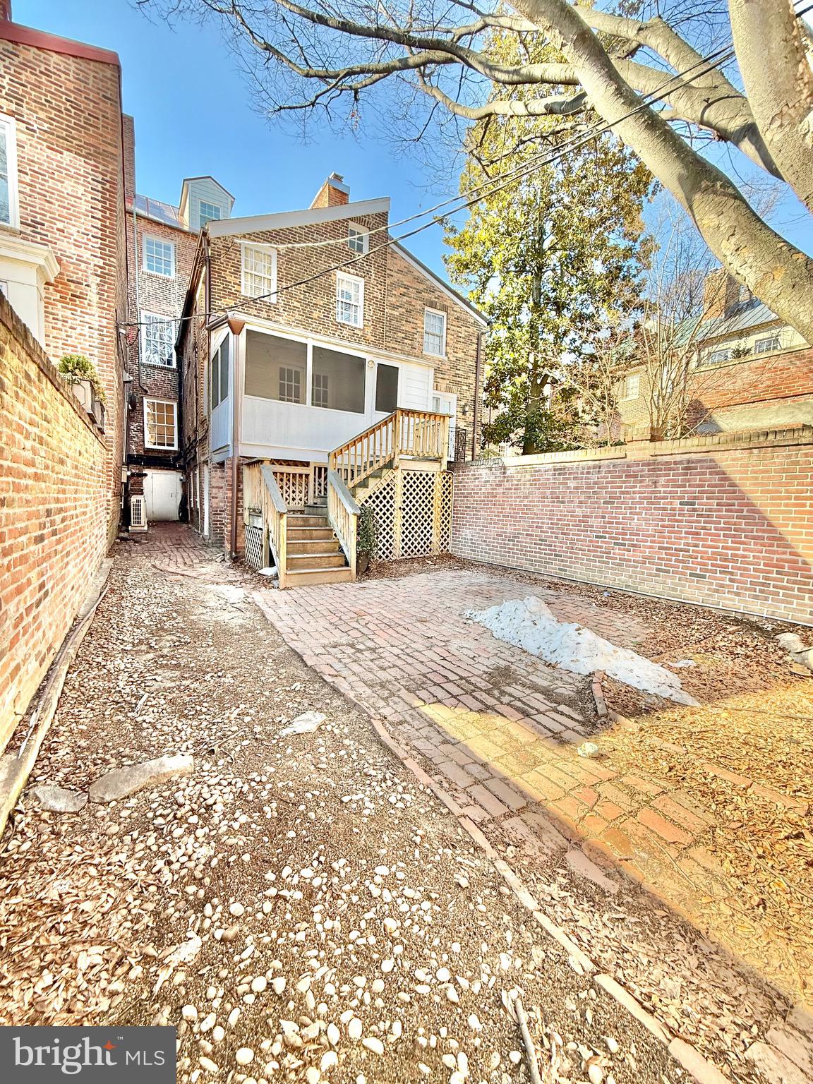 119 Prince Street, Unit 1 Alexandria, VA 22314 - Photo 23 of 29 a view of a blue house with a yard