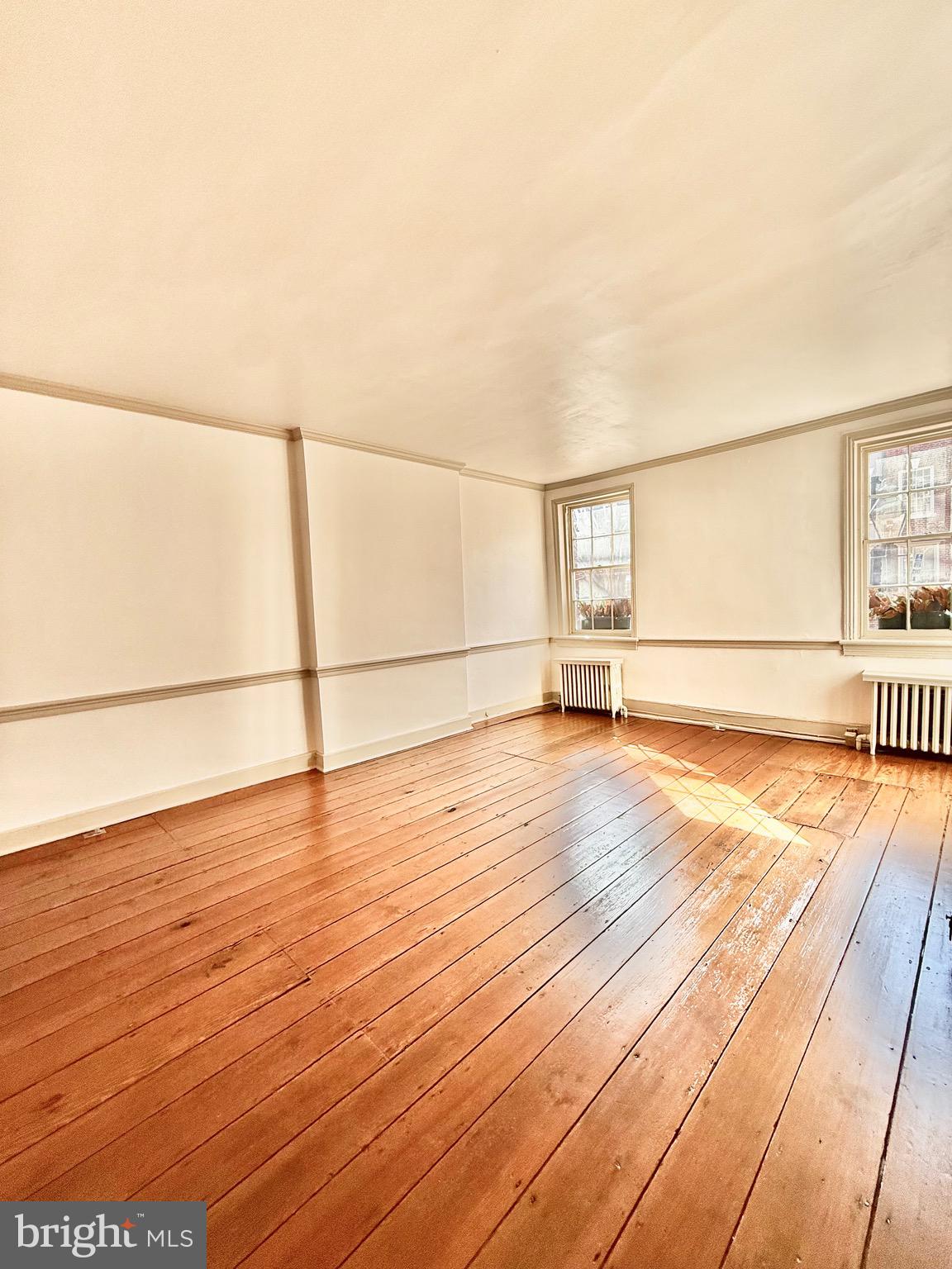 119 Prince Street, Unit 1 Alexandria, VA 22314 - Photo 4 of 29 a view of a room with wooden floor