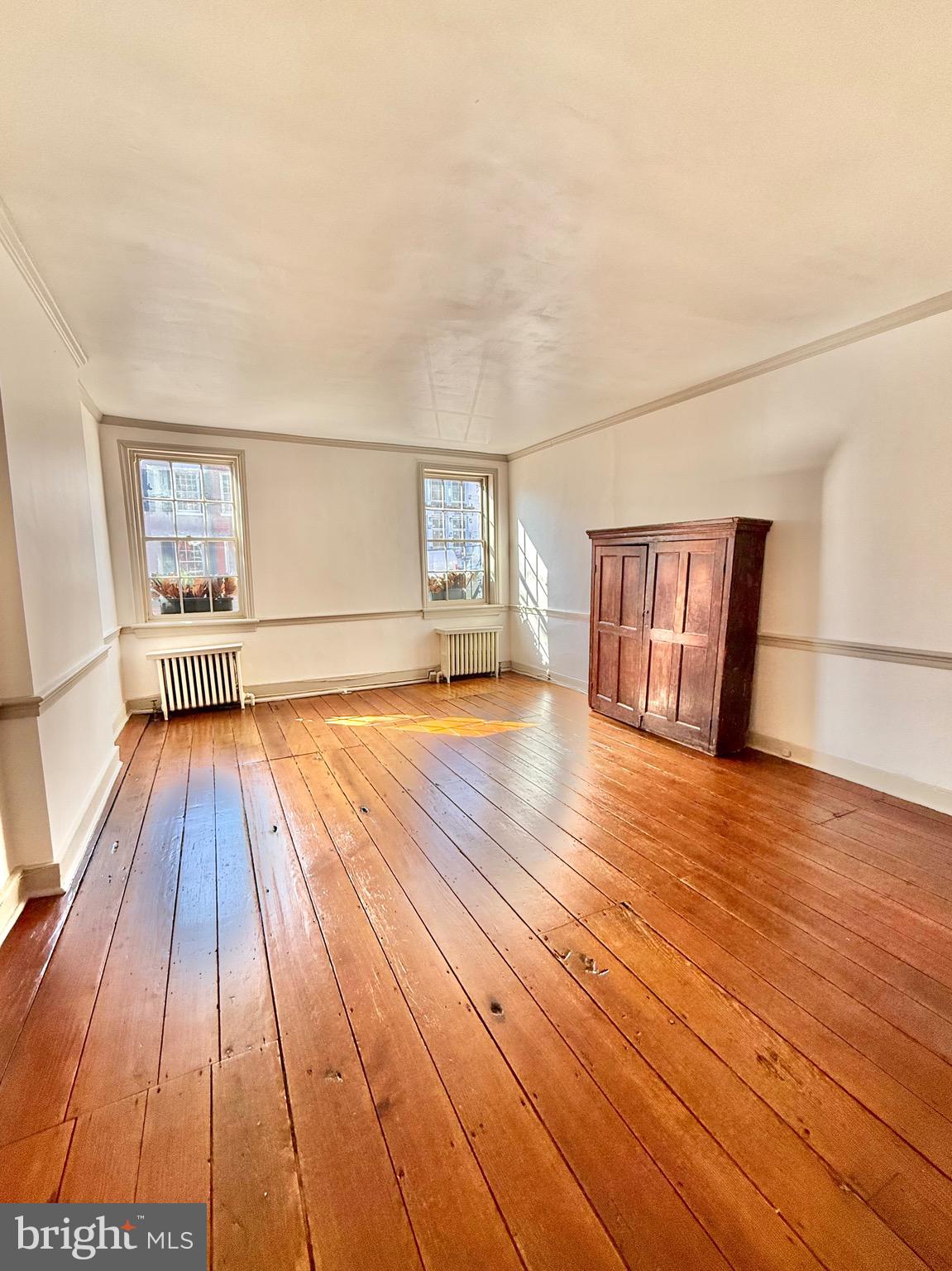 119 Prince Street, Unit 1 Alexandria, VA 22314 - Photo 5 of 29 a view of empty room with wooden floor and fan