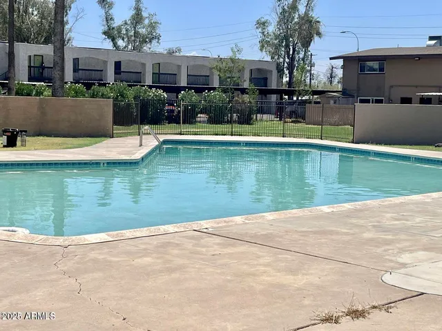 a view of a swimming pool with a patio