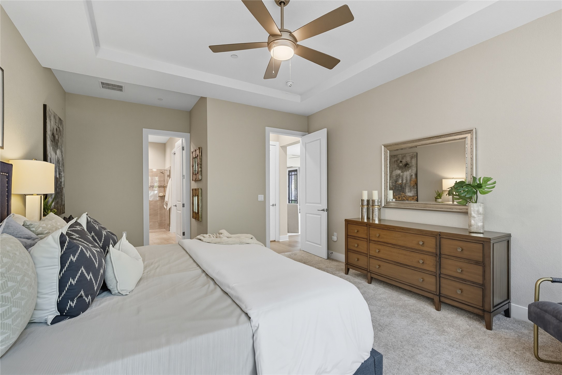 4323 Spicewood Springs Road, Unit 1 Austin, TX 78759 - Photo 11 of 35 a bedroom with a bed and a chandelier