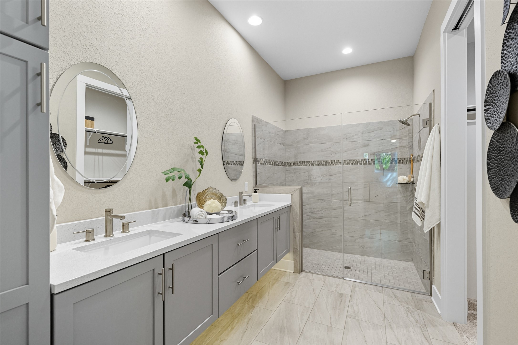 4323 Spicewood Springs Road, Unit 1 Austin, TX 78759 - Photo 13 of 35 a bathroom with a double vanity sink mirror and shower