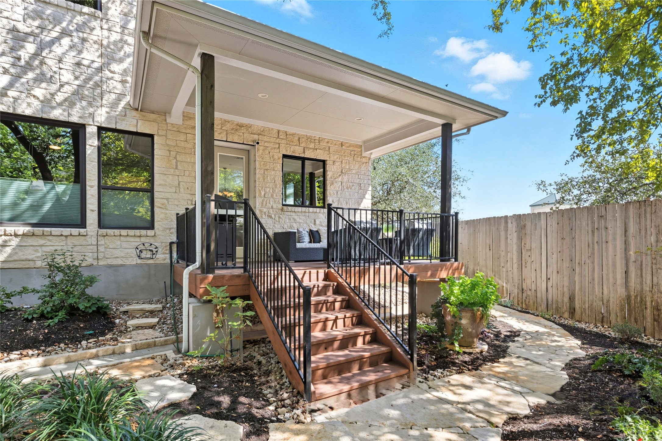 4323 Spicewood Springs Road, Unit 1 Austin, TX 78759 - Photo 20 of 35 a view of a porch with furniture and garden