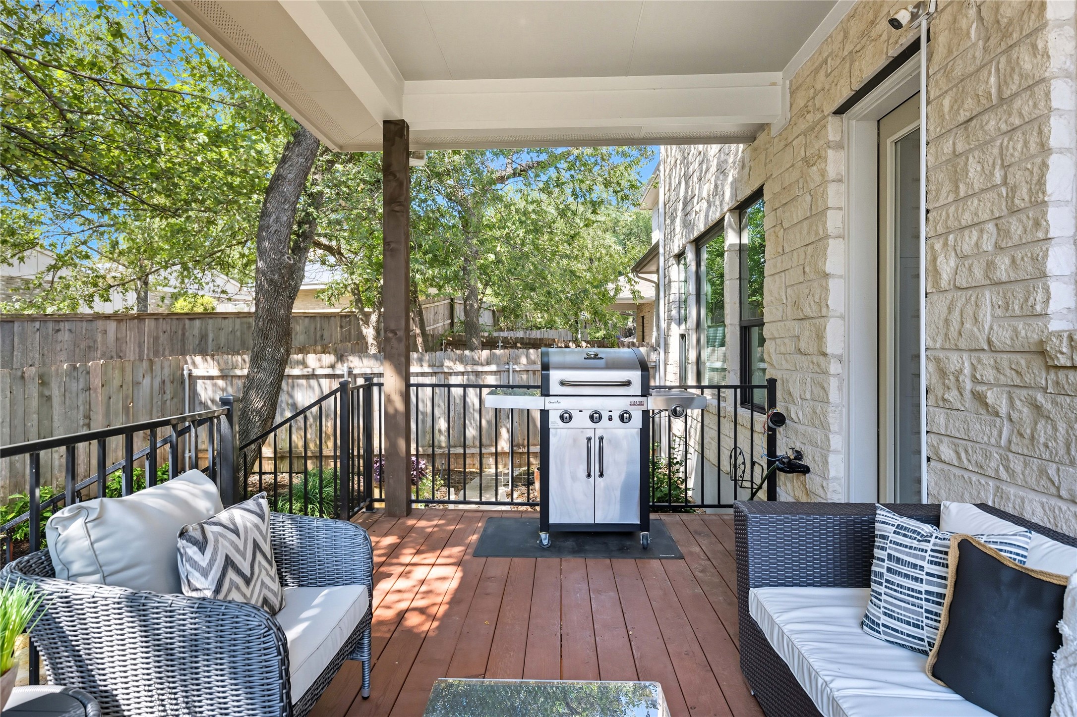 4323 Spicewood Springs Road, Unit 1 Austin, TX 78759 - Photo 21 of 35 a balcony with furniture and wooden floor